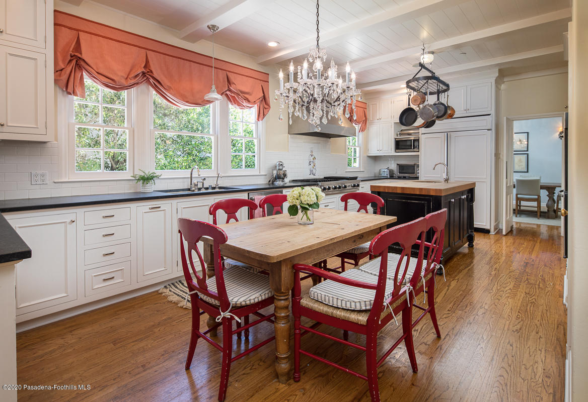 153 Sierra View Road Pasadena, CA 91105 - Photo 19 of 54 a view of a dining room with furniture a chandelier and wooden floor