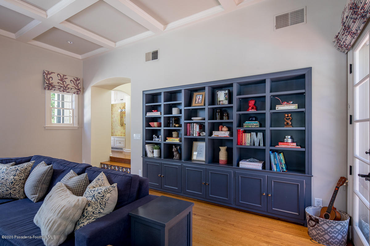 153 Sierra View Road Pasadena, CA 91105 - Photo 26 of 54 a living room with furniture cabinets and a book shelf