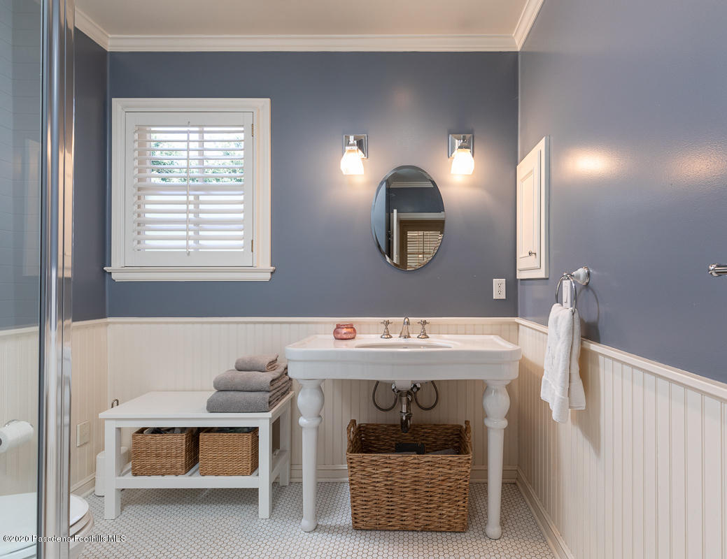 153 Sierra View Road Pasadena, CA 91105 - Photo 28 of 54 a bathroom with a sink and a mirror