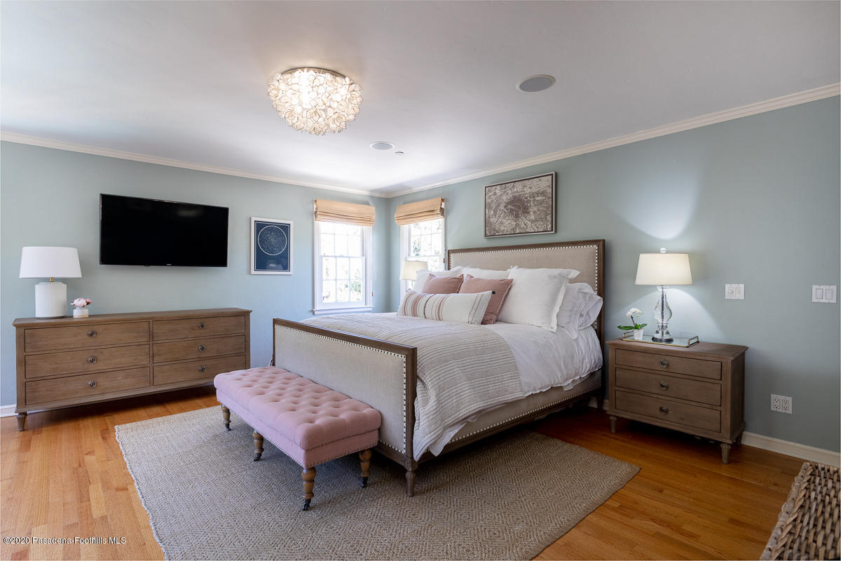 153 Sierra View Road Pasadena, CA 91105 - Photo 30 of 54 a spacious bedroom with a bed and a flat screen tv