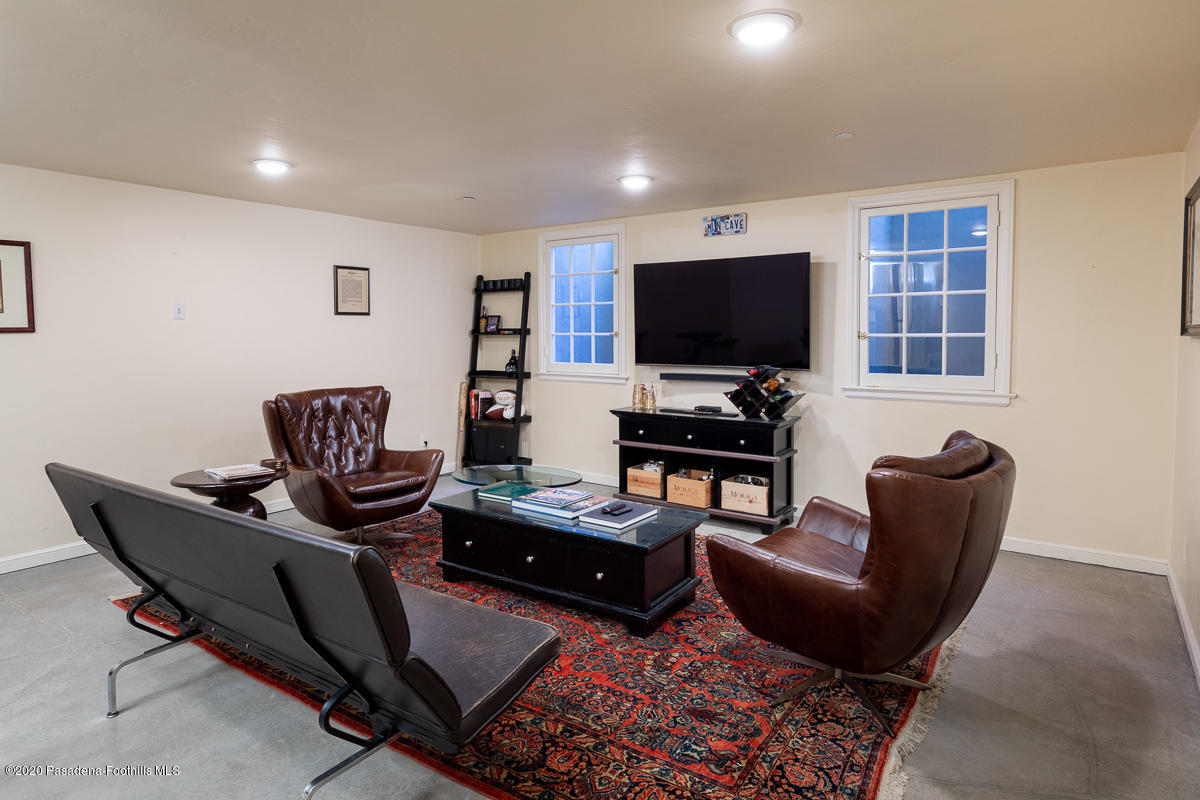 153 Sierra View Road Pasadena, CA 91105 - Photo 43 of 54 a living room with furniture and a flat screen tv
