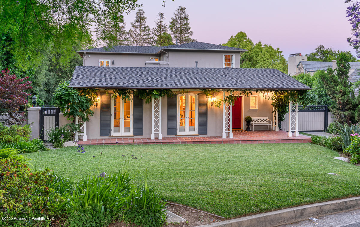 153 Sierra View Road Pasadena, CA 91105 - Photo 6 of 54 a view of a house with table and chairs under an umbrella