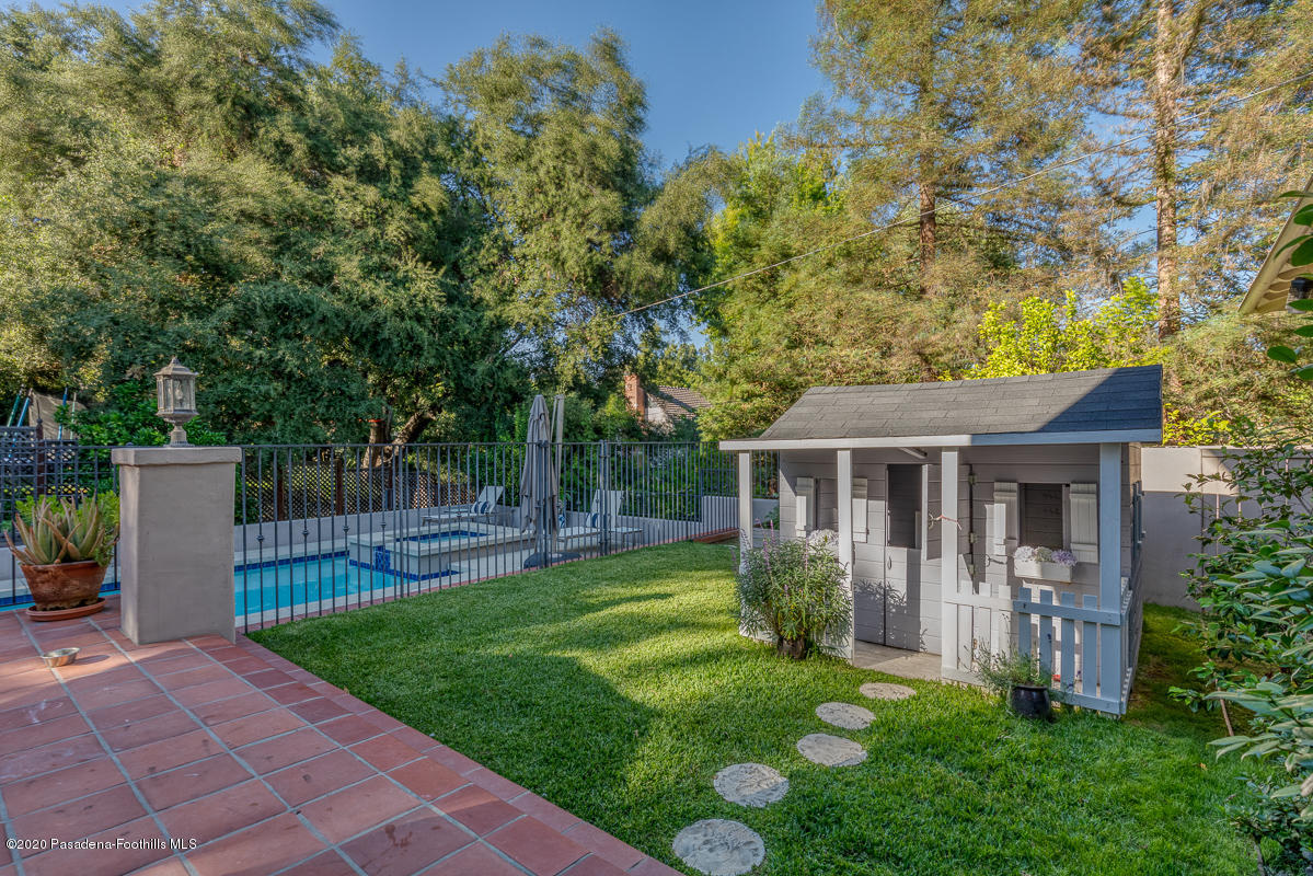 153 Sierra View Road Pasadena, CA 91105 - Photo 52 of 54 a view of house with a big yard and potted plants