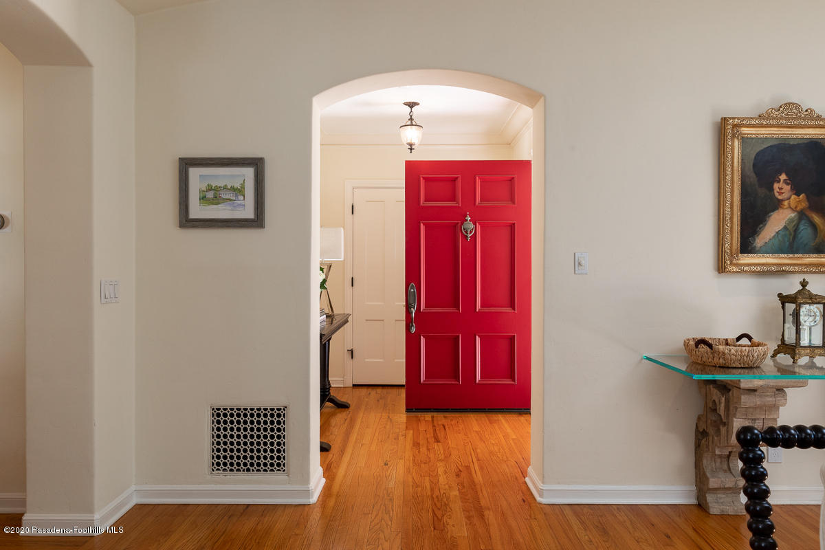 153 Sierra View Road Pasadena, CA 91105 - Photo 9 of 54 a view of a hallway with wooden floor and a cabinet