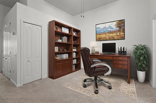 a view of a workspace with furniture