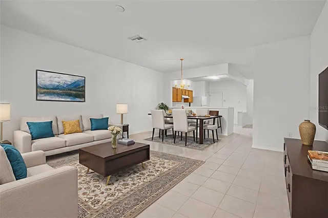 a living room with furniture and a table