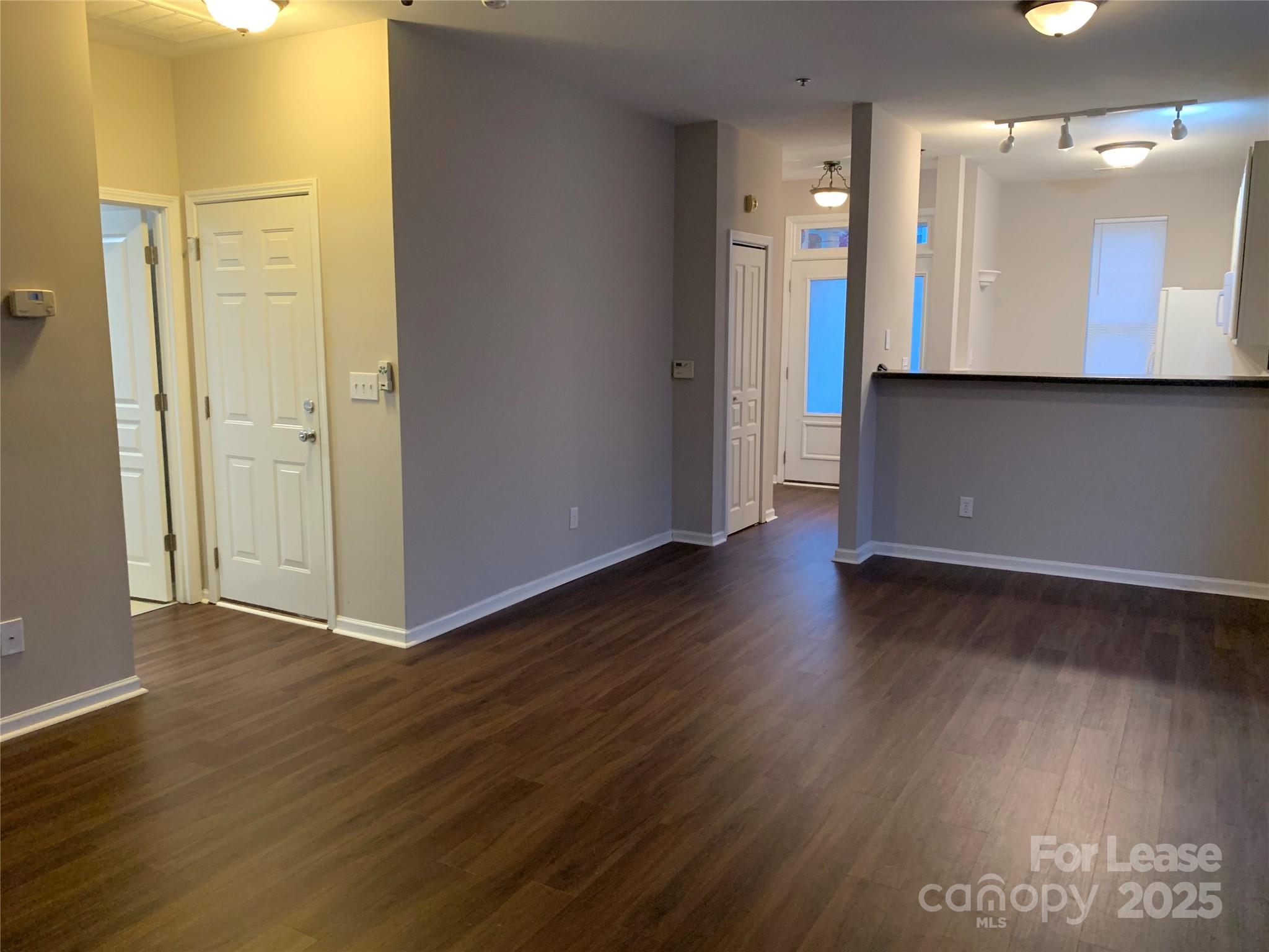 2726 Avalon Loop Road Charlotte, NC 28269 - Photo 2 of 12 a view of a hallway with wooden floor