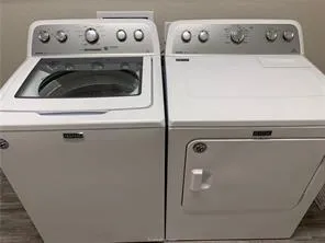 a close up view of washer and dryer