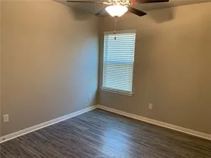 wooden floor and window in an empty room