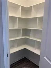 a storage room with a wooden floor