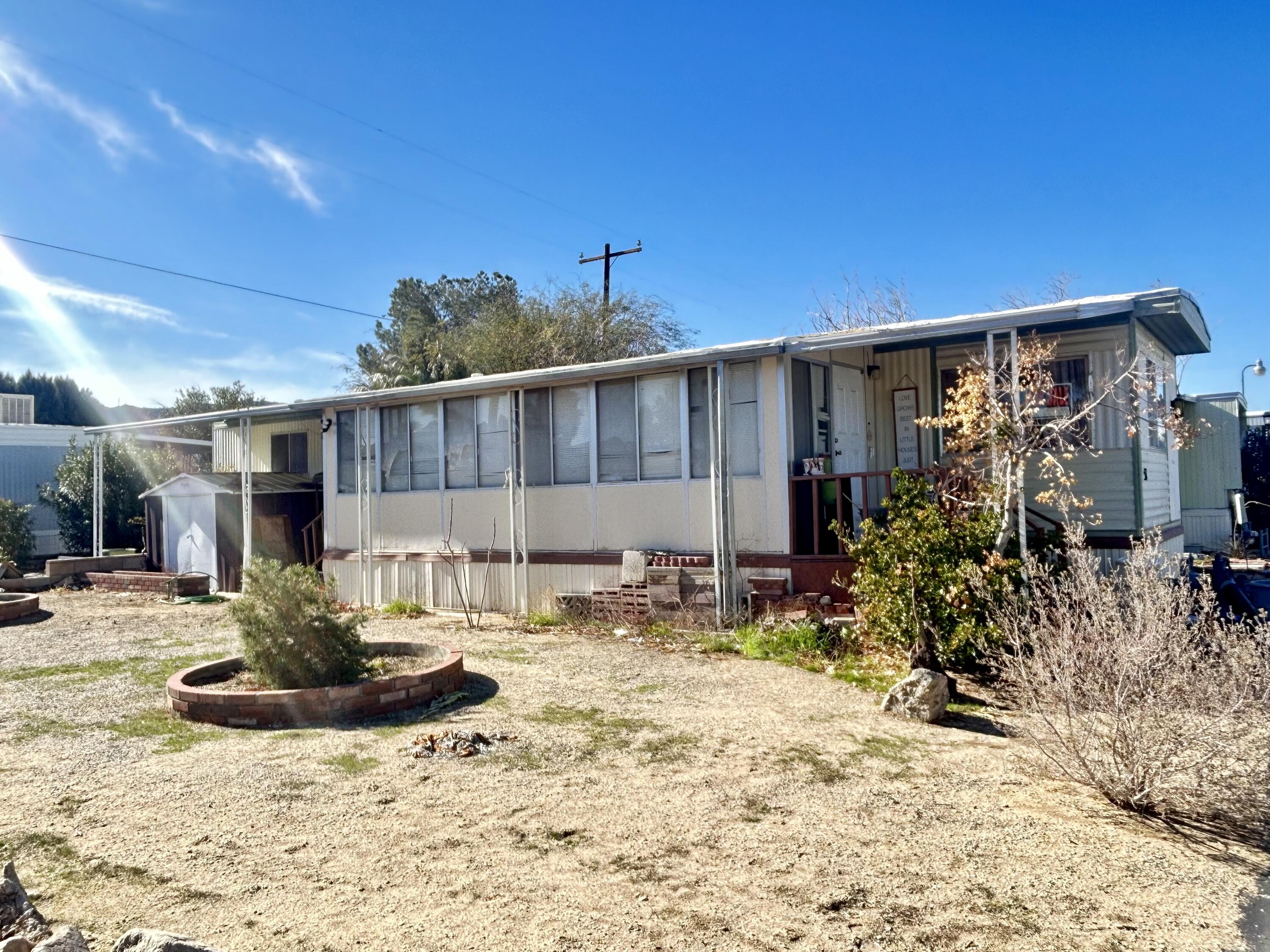 6426 Valley View Street Joshua Tree, CA 92252 - Photo 2 of 15 a view of a house with backyard of house