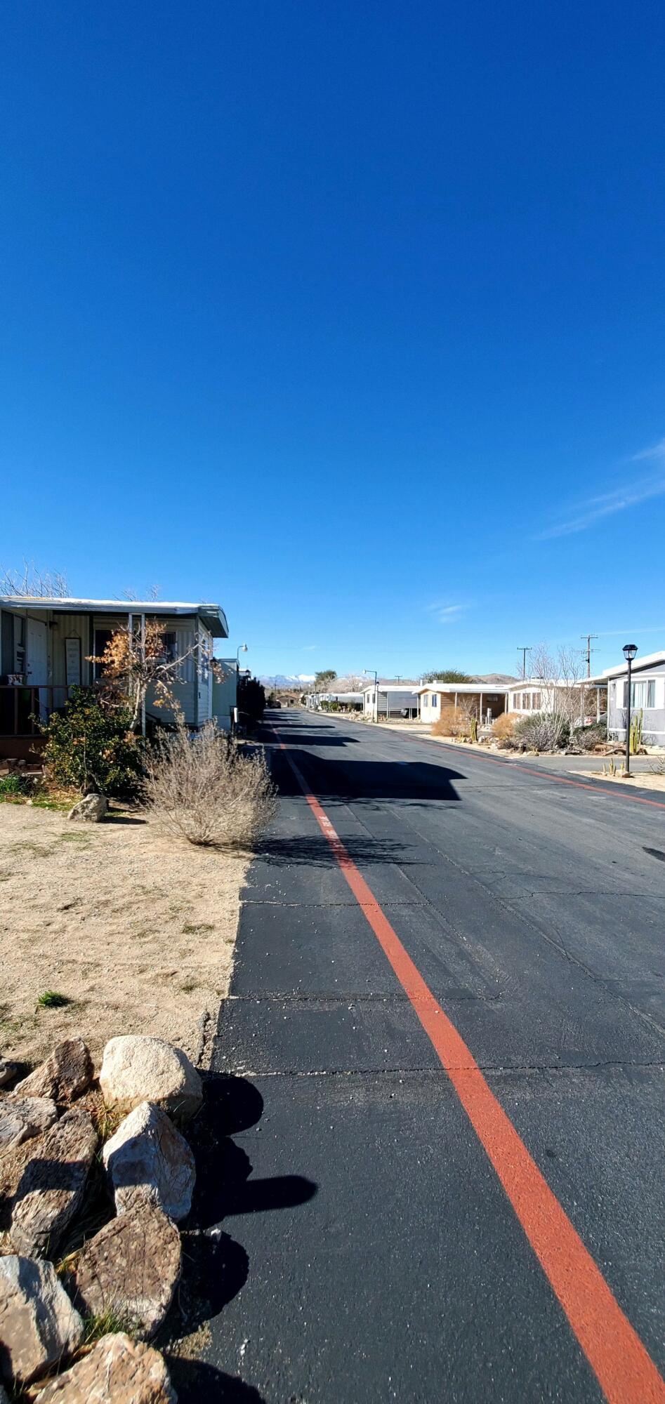 6426 Valley View Street Joshua Tree, CA 92252 - Photo 6 of 15 a view of car parked on the road
