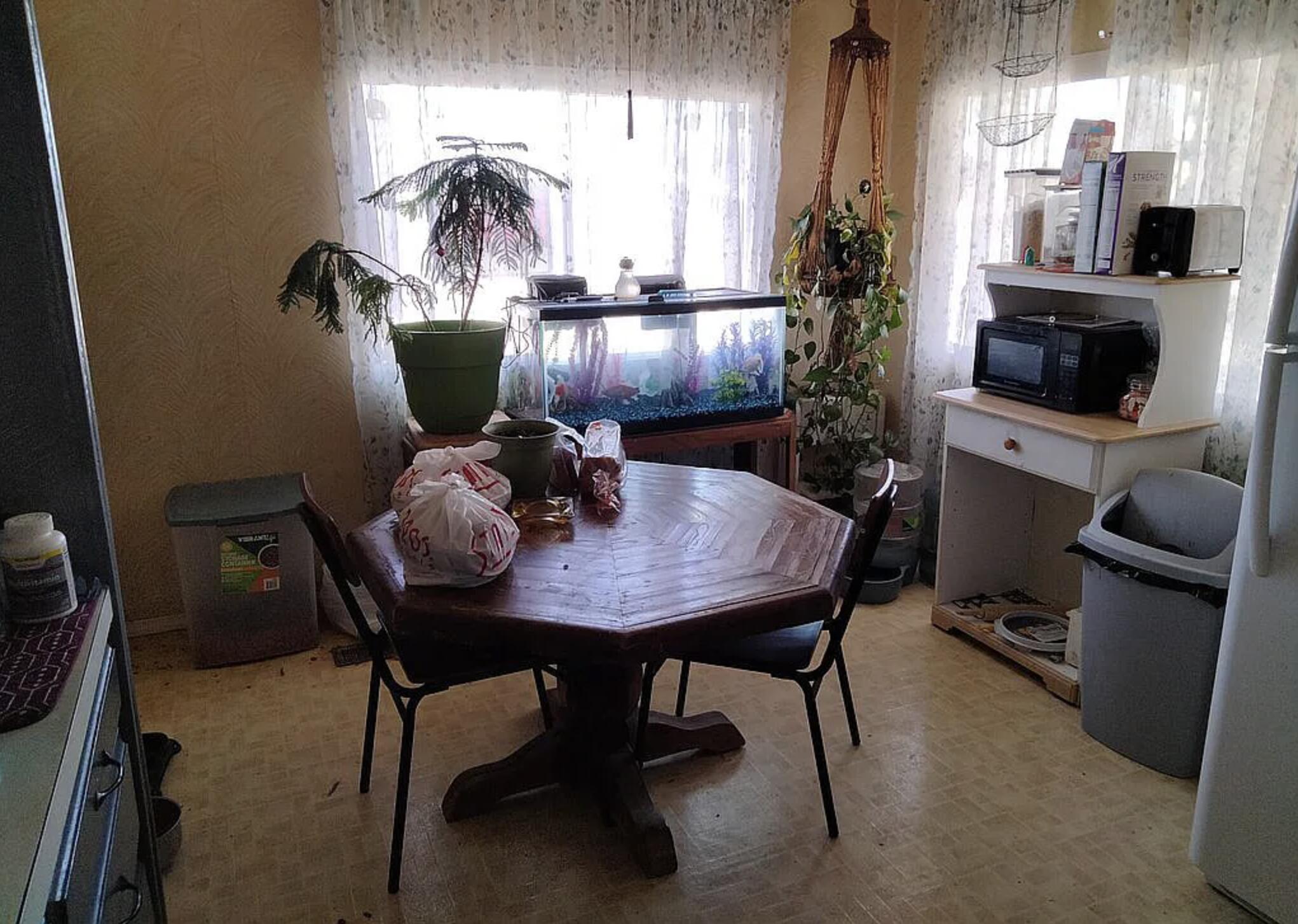 6426 Valley View Street Joshua Tree, CA 92252 - Photo 10 of 15 a view of a dining room with furniture and chandelier