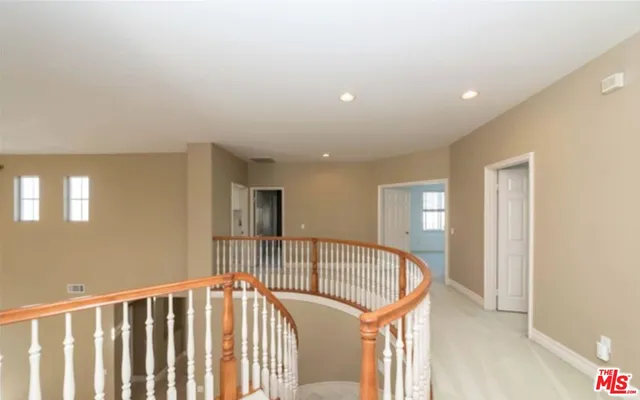 a view of a hallway with a bedroom