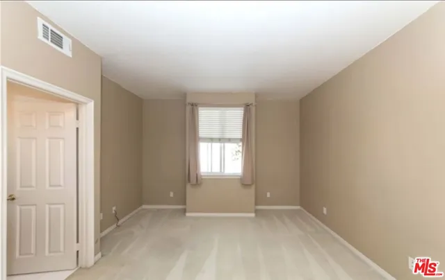 a view of an empty room with window