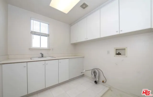 a bathroom with a sink and a window