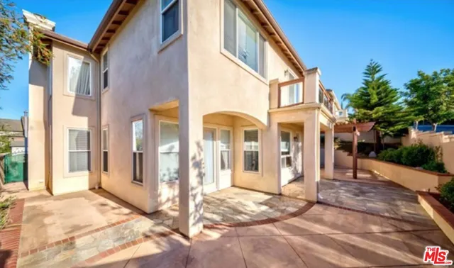 a view of a brick building with many windows