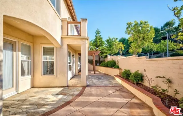 a view of a brick house with a yard