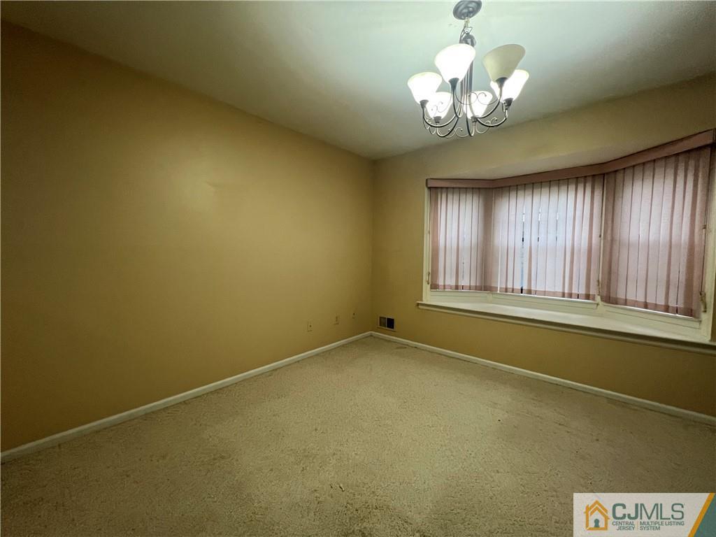 204 Maplecrest Road Edison, NJ 08820 - Photo 8 of 9 a view of an empty room with a window