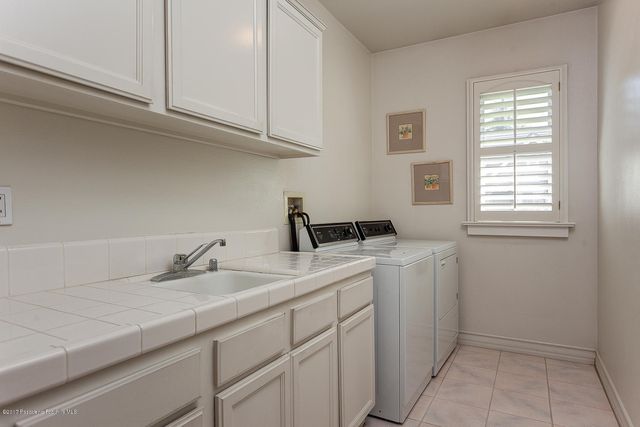a view with a sink and cabinets