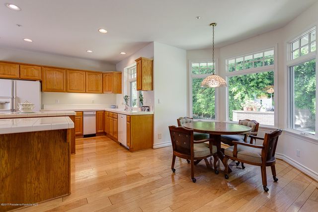 a view of a dining table and chairs