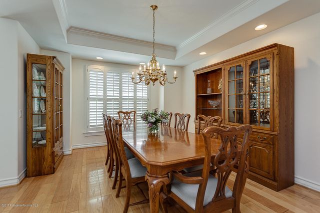 a view of a dining room with furniture and window