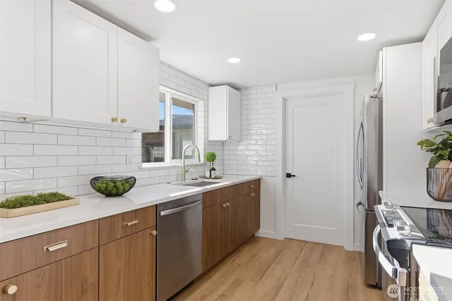 a kitchen with a sink and cabinets