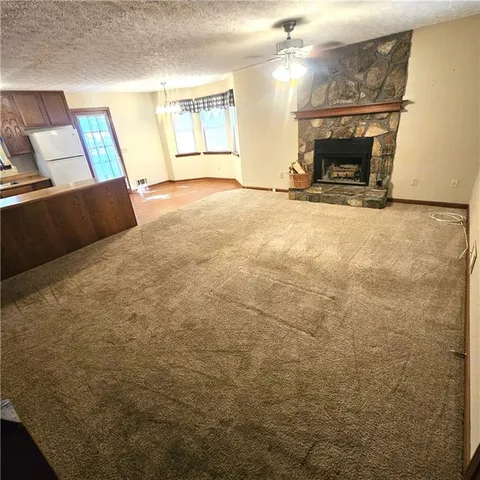 a view of an empty room with windows