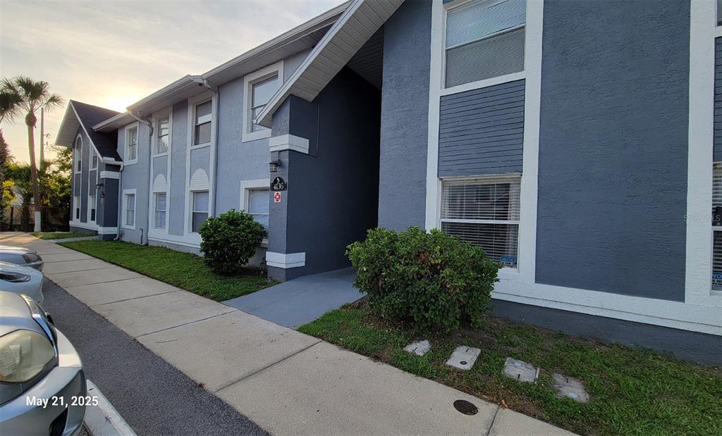 4136 Pershing Pointe Place, Unit 5 Orlando, FL 32822 - Photo 1 of 21 a view of a house with a yard