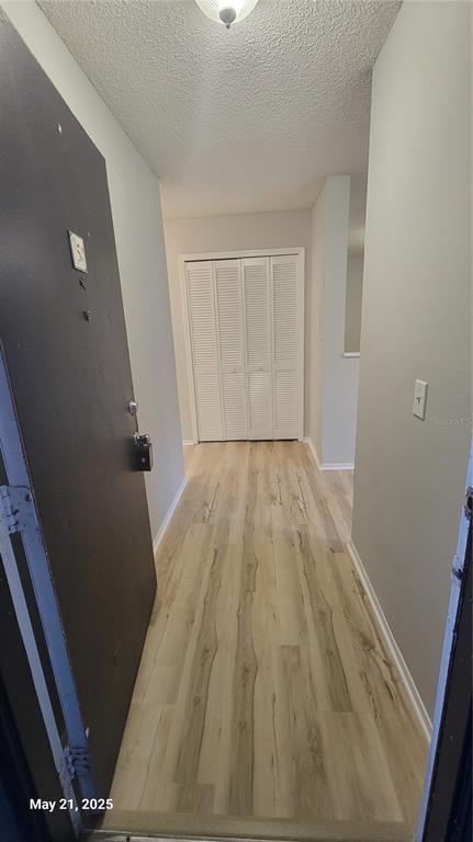 4136 Pershing Pointe Place, Unit 5 Orlando, FL 32822 - Photo 12 of 21 a view of empty room with wooden floor