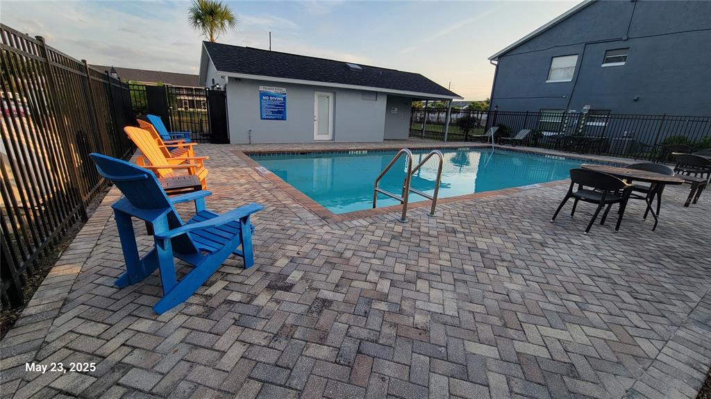 4136 Pershing Pointe Place, Unit 5 Orlando, FL 32822 - Photo 17 of 21 a backyard view of a house with seating space and barbeque oven
