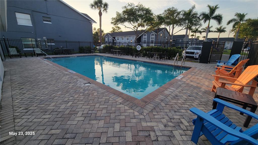 4136 Pershing Pointe Place, Unit 5 Orlando, FL 32822 - Photo 18 of 21 a view of a swimming pool with a patio