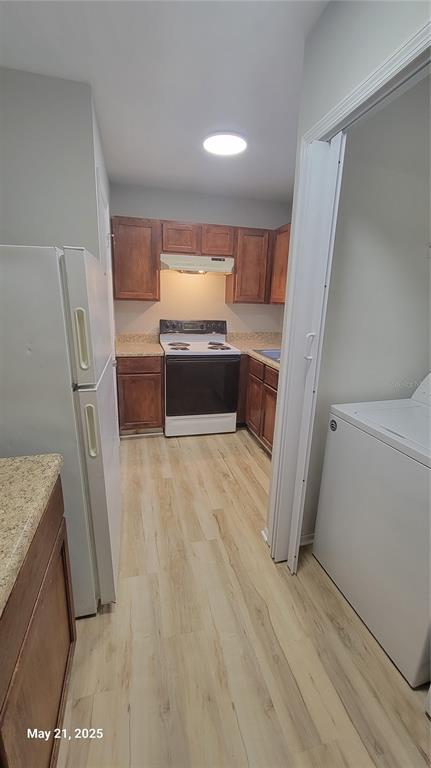 4136 Pershing Pointe Place, Unit 5 Orlando, FL 32822 - Photo 3 of 21 a room with a washer and dryer