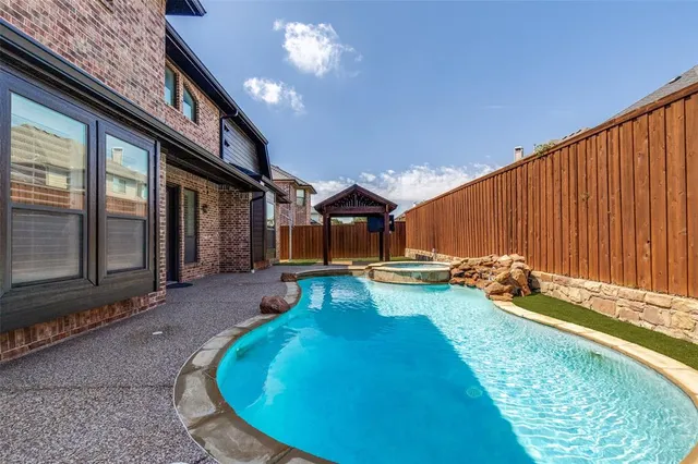 a view of a house with swimming pool