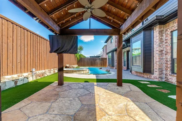 a view of a swimming pool in the backyard