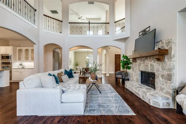 a living room with fireplace furniture and a fireplace