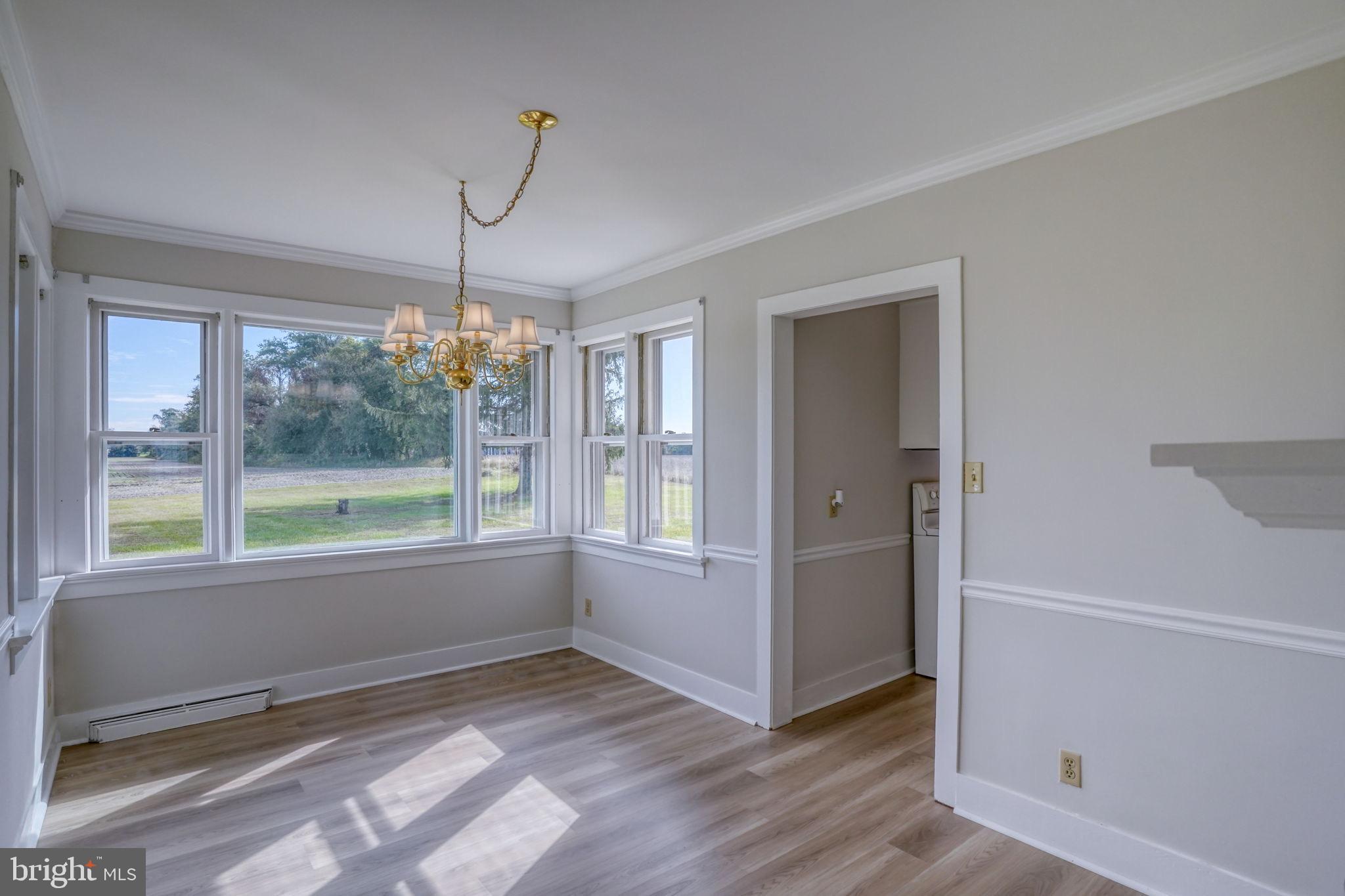 2968 Deep Grass Lane Houston, DE 19954 - Photo 26 of 41 wooden floor in an empty room with a window
