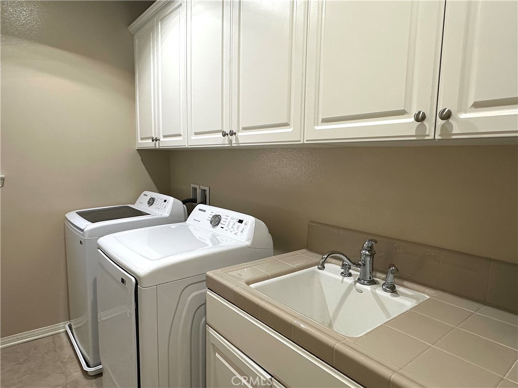20420 West Vía Urbino Porter Ranch, CA 91326 - Photo 15 of 22 Upstairs Laundry Room
