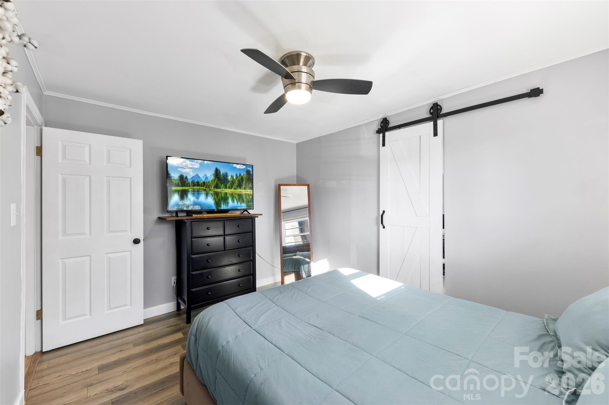 652 Dallas Spencer Mountain Road Dallas, NC 28034 - Photo 18 of 26 a bedroom with a bed and a flat tv screen