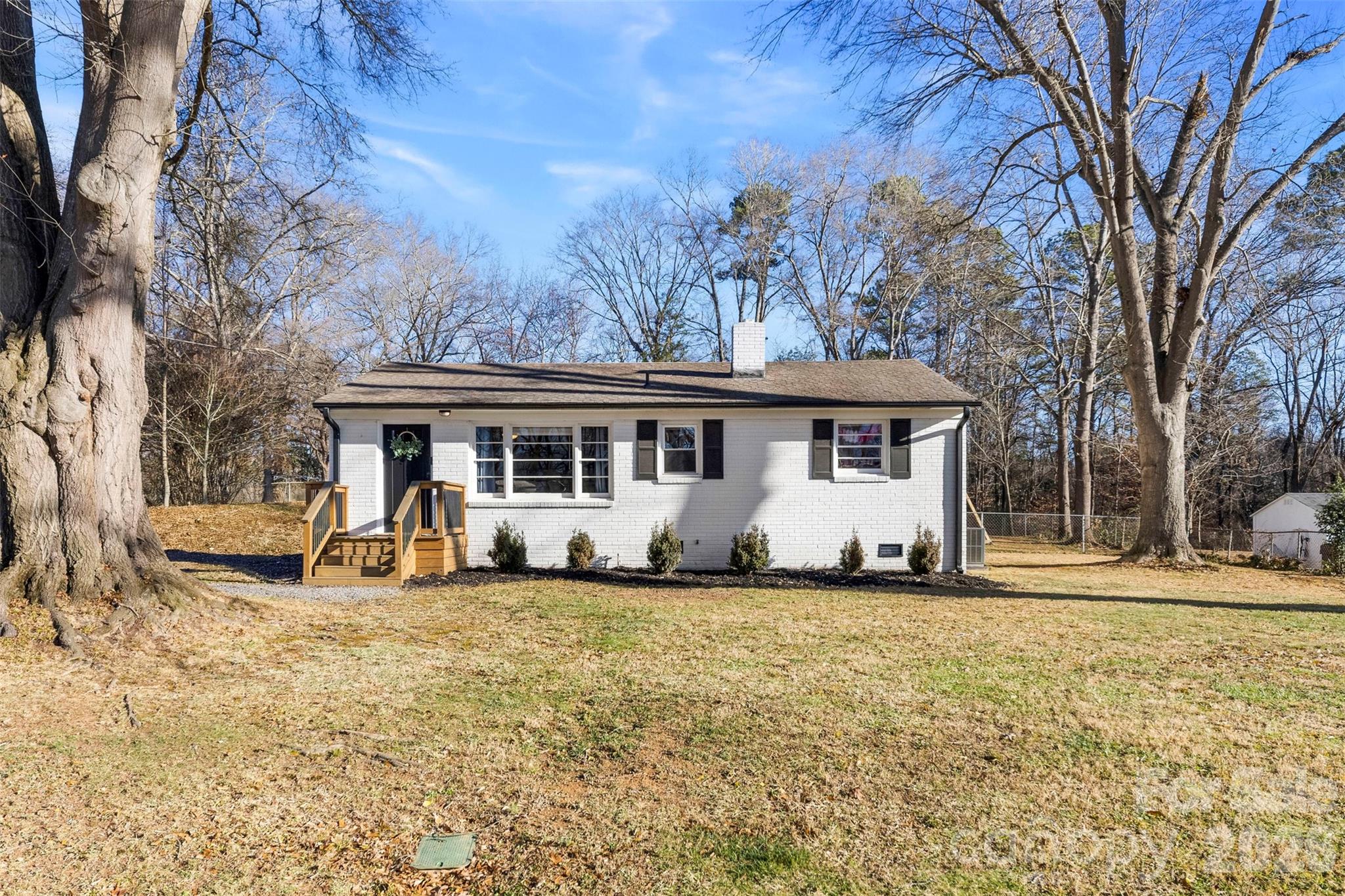 652 Dallas Spencer Mountain Road Dallas, NC 28034 - Photo 2 of 26 a front view of a house with a yard