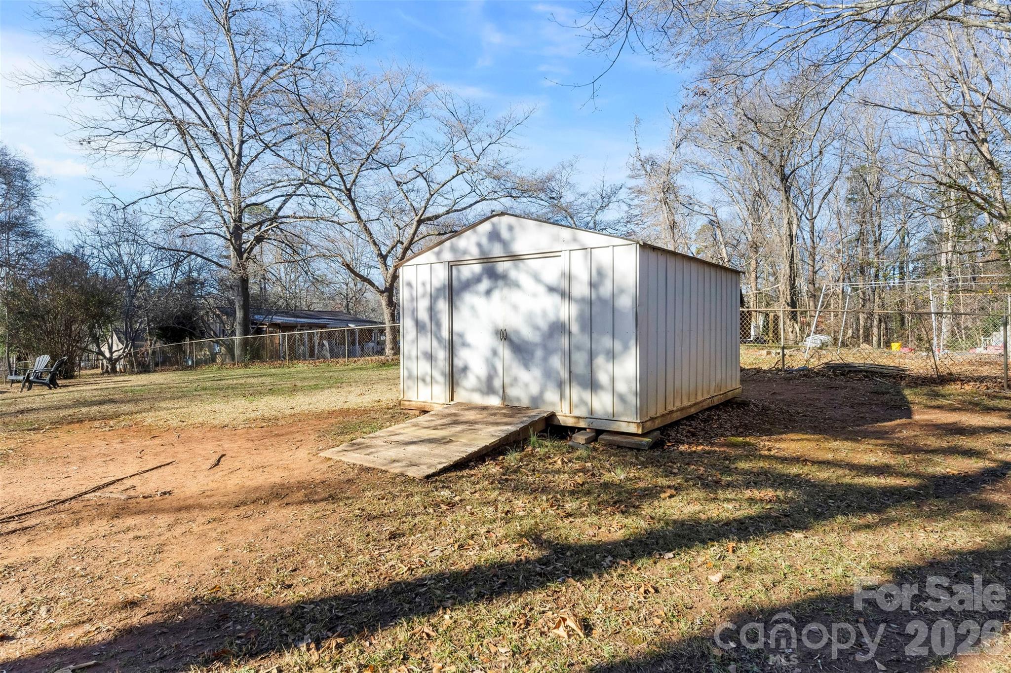 652 Dallas Spencer Mountain Road Dallas, NC 28034 - Photo 24 of 26 a view of backyard with large trees