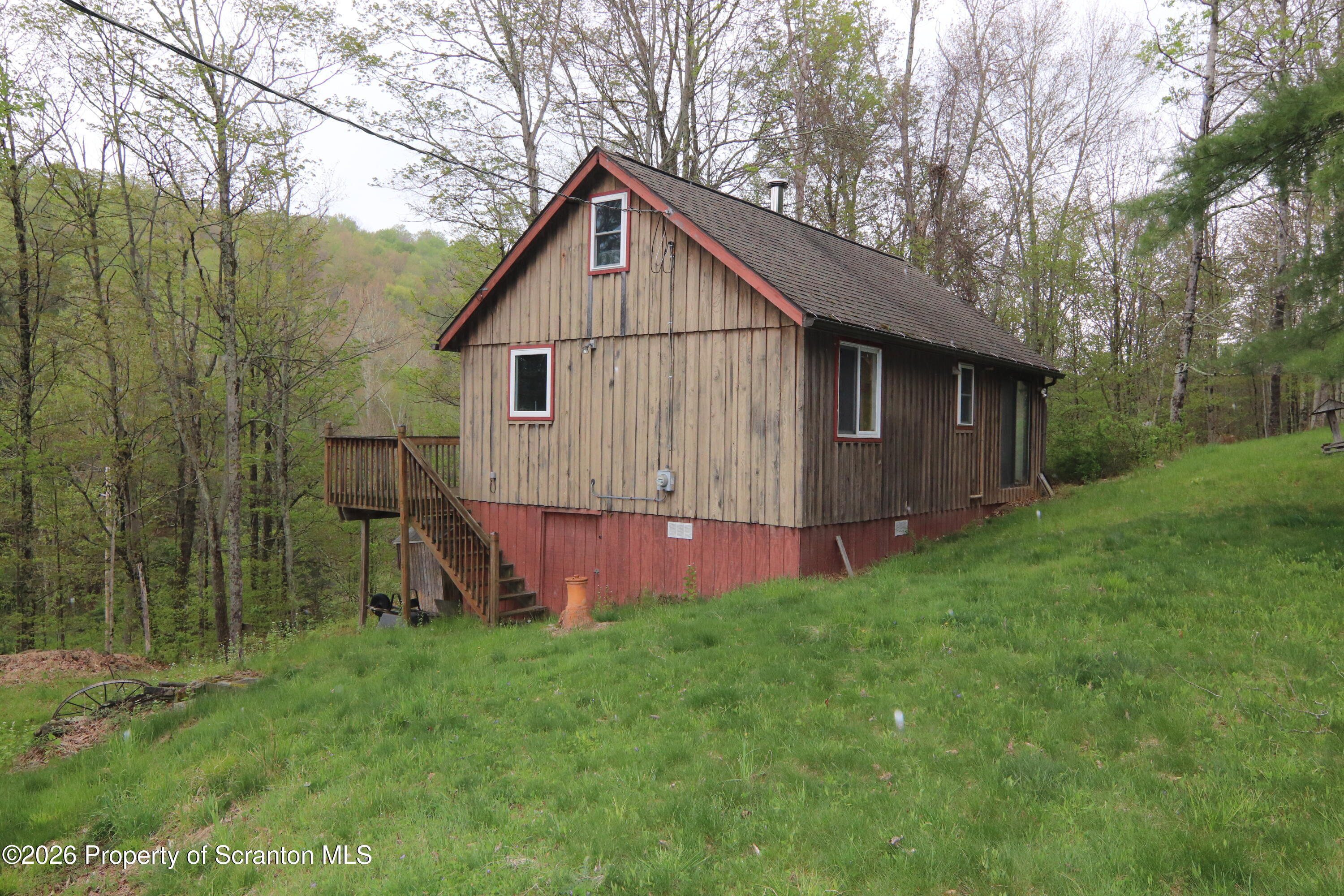 300 Pennsworth Hill Road Meshoppen, PA 18630 - Photo 2 of 38 a view of a backyard with a small cabin