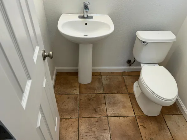 a bathroom with a toilet and a sink