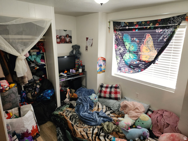 11362 Crescent Park Way, Unit 8 Sandy, UT 84070 - Photo 8 of 20 Bedroom with wood finished floors and a closet