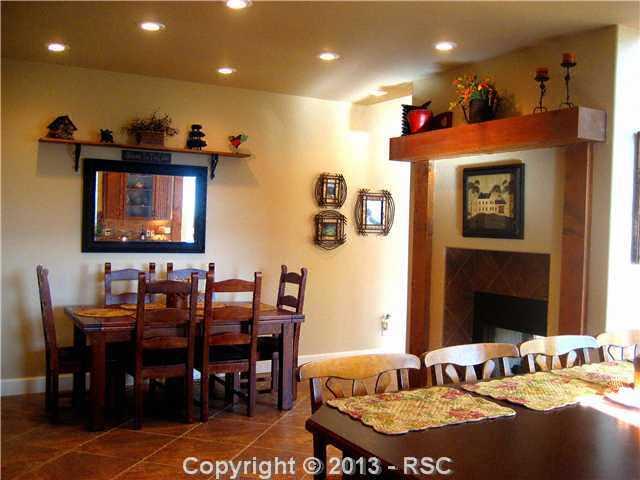 576 Ute Road Westcliffe, CO 81252 - Photo 12 of 25 DINING ROOM OPEN TO THE KITCHEN WITH COZY FIREPLACE