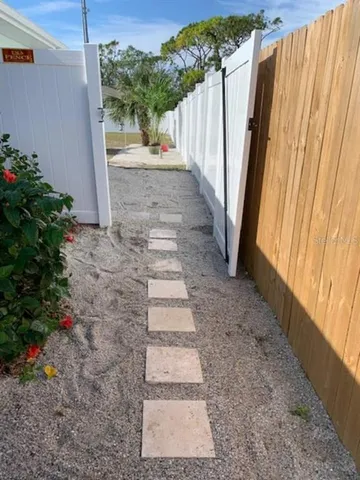 a view of a pathway with a yard