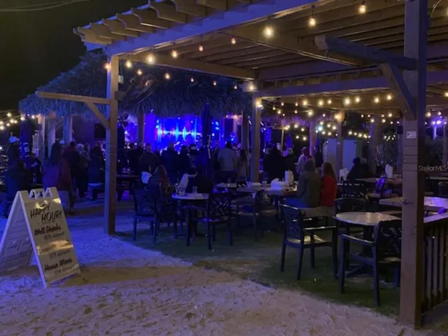 a view of a tables and chairs in patio