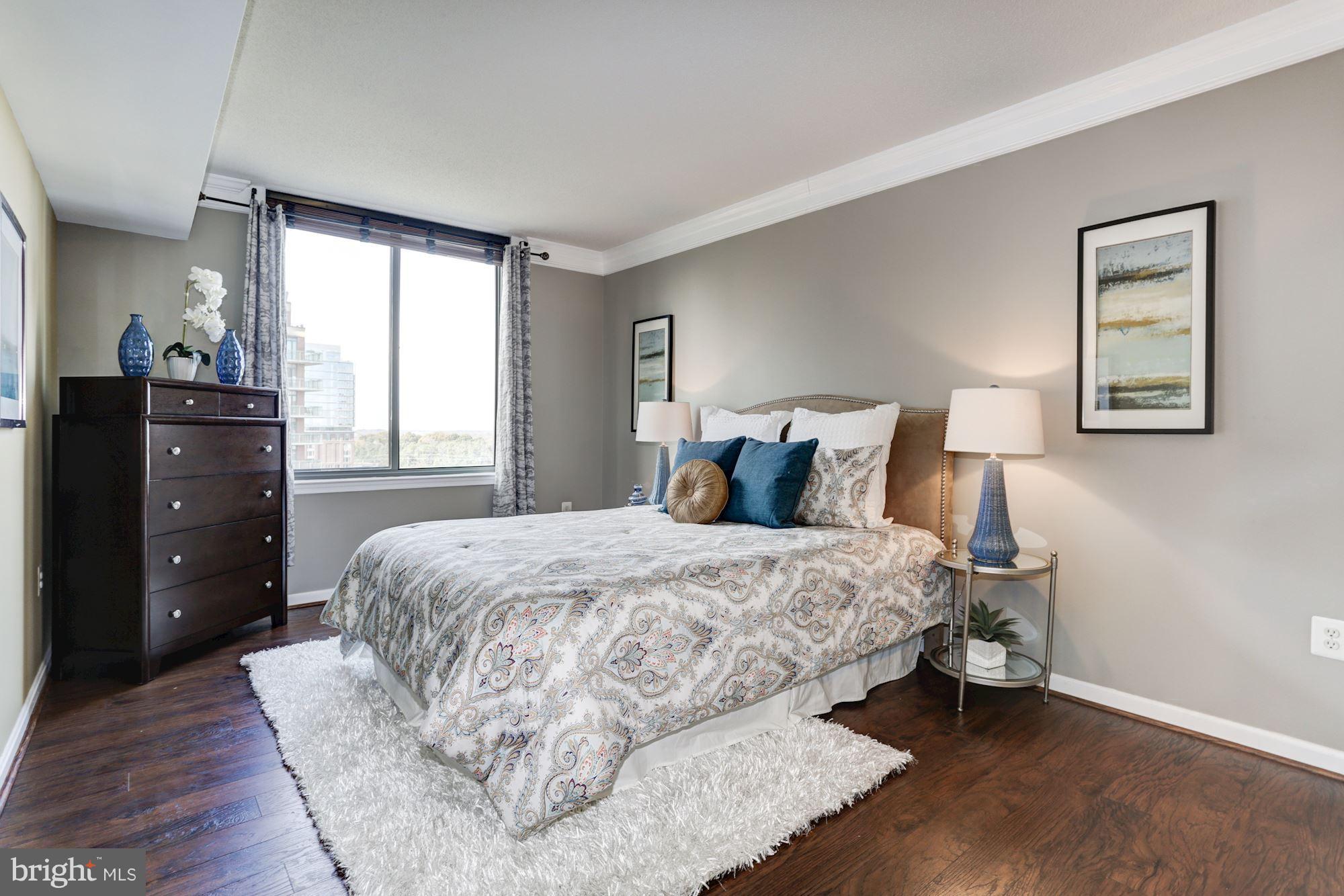 11710 Old Georgetown Road, Unit 1127 North Bethesda, MD 20852 - Photo 12 of 30 a bedroom with a bed and a closet
