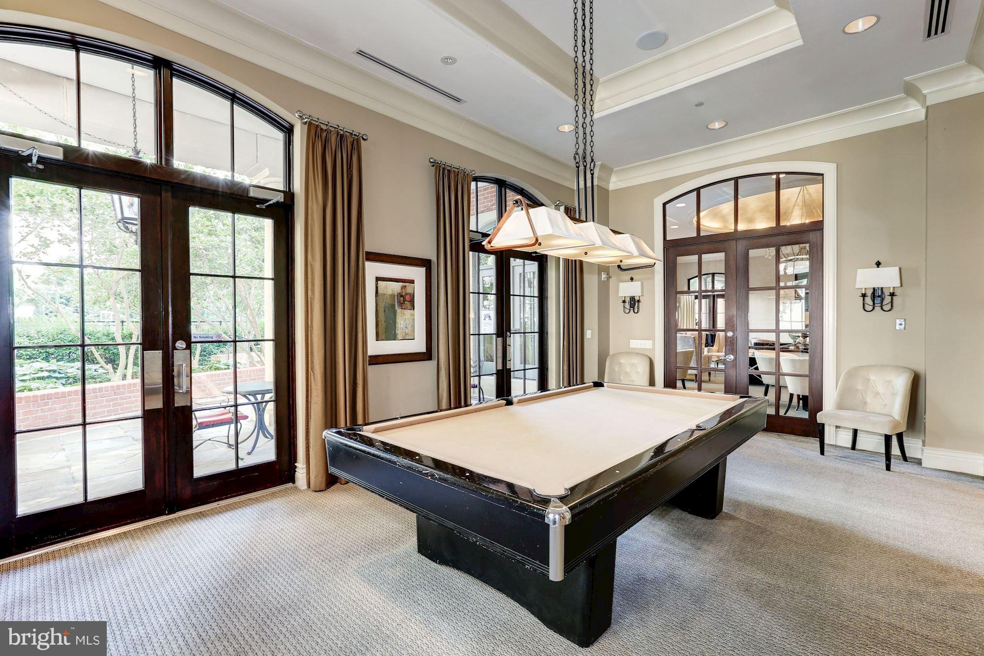 11710 Old Georgetown Road, Unit 1127 North Bethesda, MD 20852 - Photo 28 of 30 a room with pool table and windows