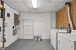 a bathroom with a double vanity sink a mirror and a bathtub